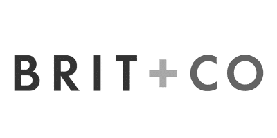 BRIT+CO logo in bold, modern black and gray lettering on a white background, with a plus sign between BRIT and CO.