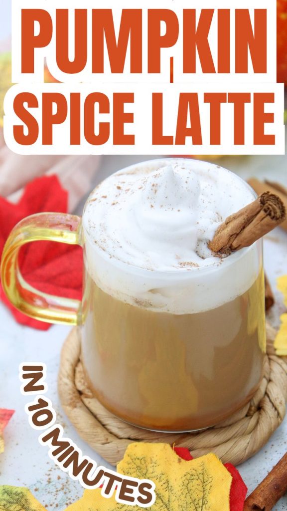 A glass mug filled with pumpkin spice latte with almond milk, topped with whipped cream and a cinnamon stick, surrounded by colorful autumn leaves. Text reads Pumpkin Spice Latte in 10 minutes.