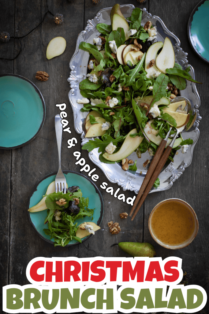 A festive platter of pear and apple salad with walnuts, greens, and blue cheese—perfect for christmas food and drinks—served with a fork and plate on a dark table. Text reads Pear & Apple Salad and Christmas Brunch Salad.