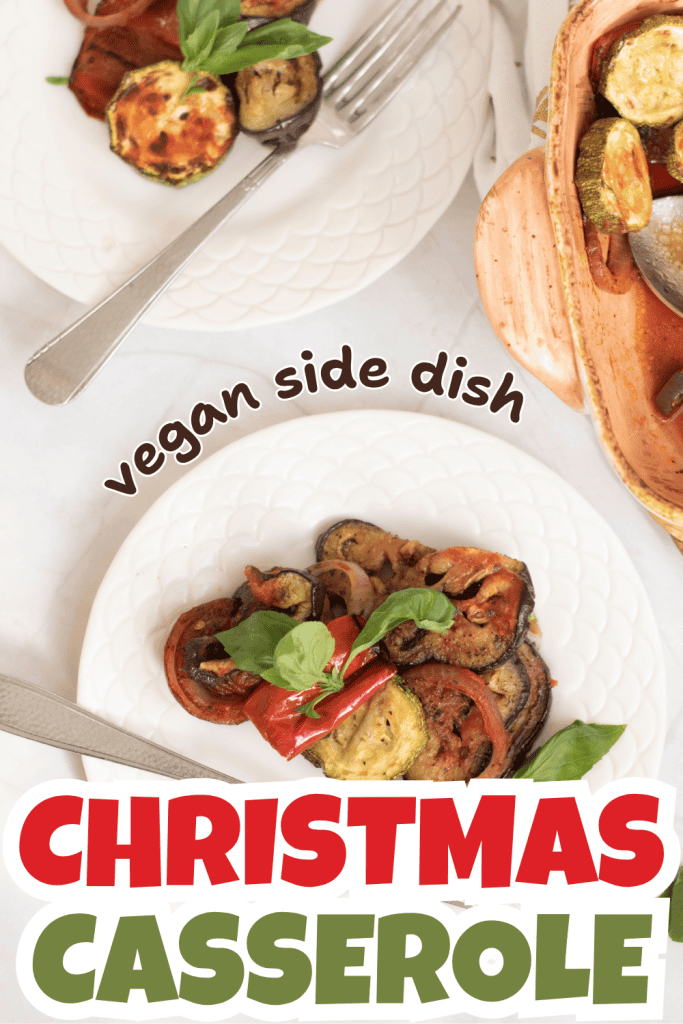Overhead view of plates with a baked vegetable casserole garnished with basil. Text on the image reads “vegan side dish” and “CHRISTMAS CASSEROLE!”—perfect for anyone looking for a festive Christmas Ratatouille Recipe.