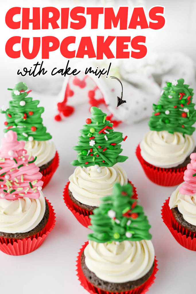 Chocolate cupcakes with white frosting in red wrappers, topped with green and pink candy christmas tree cupcakes and sprinkles, with text reading Christmas Cupcakes with cake mix! in bold red and black letters.