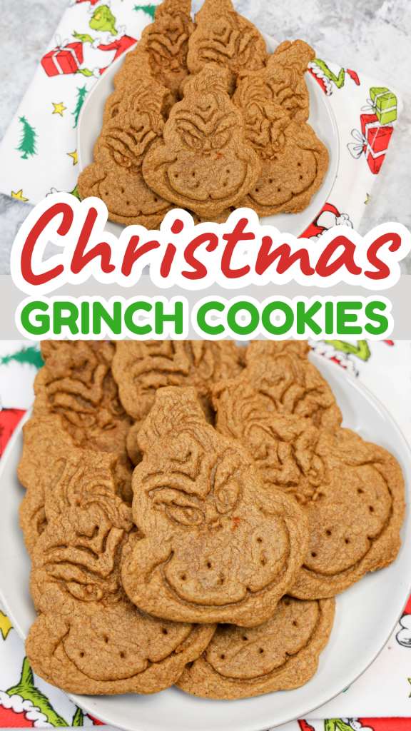 A plate of grinch themed cookies shaped like the Grinch’s face sits on a festive Christmas cloth. Text overlay reads Christmas Grinch Cookies in bold red and green letters.
