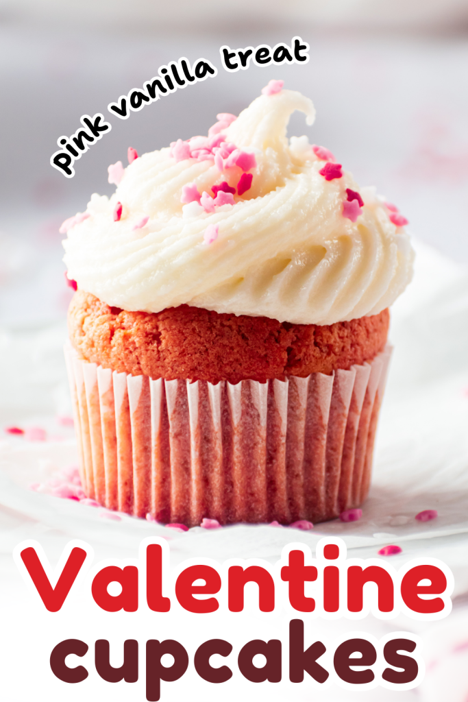 A pink vanilla cupcake with white frosting and pink sprinkles sits on a white surface. Text reads Pink Vanilla Treat and Valentine's Day Cupcakes in playful fonts.