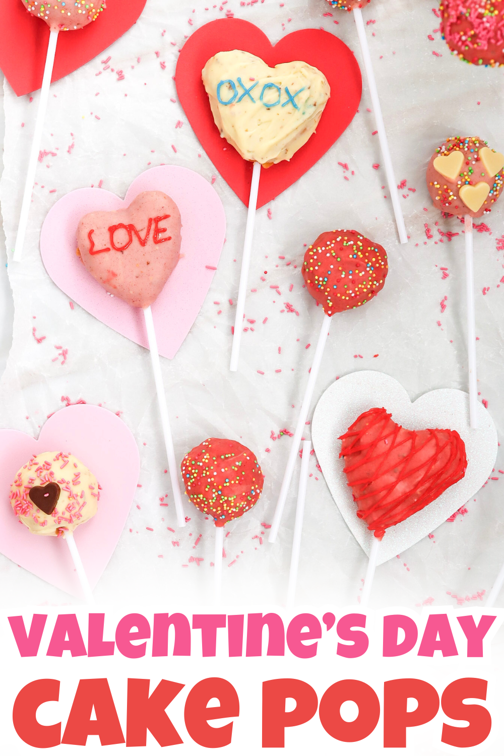 Heart-shaped and round cake pops for Valentine's Day, decorated with pink, red, and white icing, sprinkles, and words like LOVE and XOXO, are arranged on paper hearts with Valentines Day Cake Pops written at the bottom.