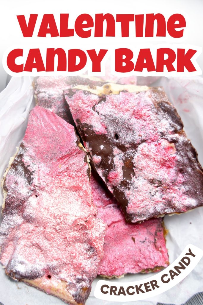 Three large pieces of chocolate cracker bark topped with pink and white sprinkles are displayed in a white dish, with bold red text reading Valentine Candy Bark and smaller text below saying Saltine Cracker Candy Recipe.