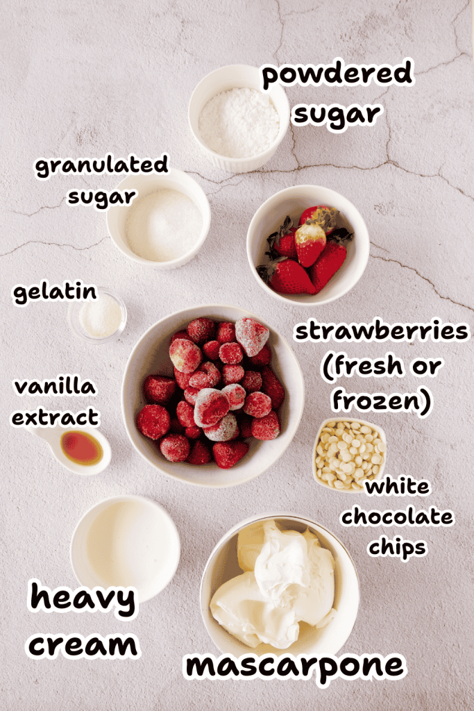 Bowls containing powdered sugar, granulated sugar, gelatin, vanilla extract, heavy cream, mascarpone, white chocolate chips, and strawberries are labeled on a light surface—perfect for preparing a delightful strawberry mascarpone dessert.