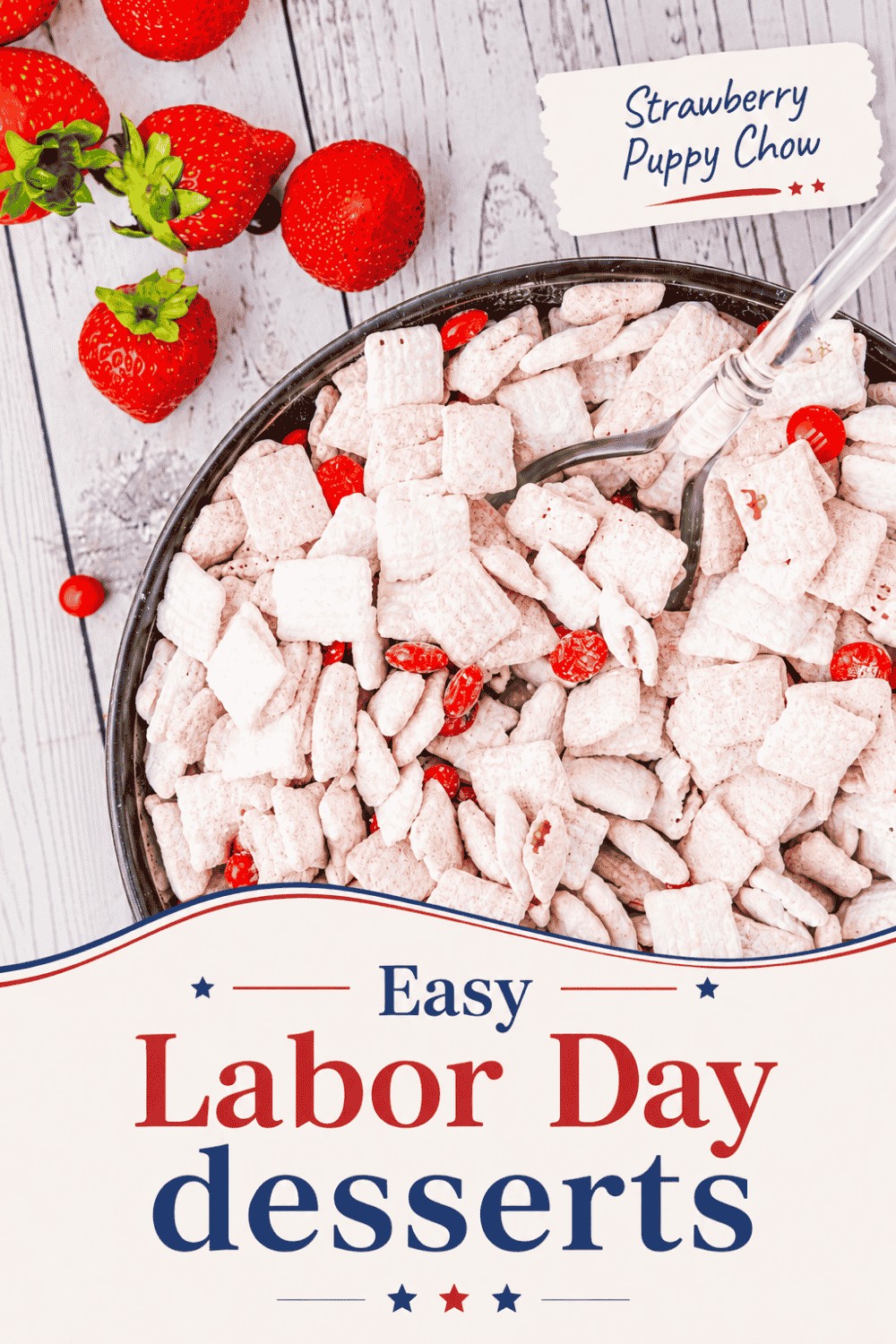 A bowl of strawberry puppy chow with a spoon, surrounded by fresh strawberries, sits on a white wooden table. The text reads: Strawberry Puppy Chow and Easy Labor Day Desserts—perfect for your next summer celebration.