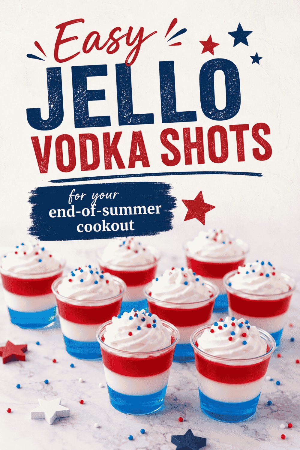 Eight red, white, and blue layered Jello vodka shots with whipped cream and sprinkles are displayed on a white surface. Text above reads, Easy Jello Vodka Shots for your end-of-summer cookout—perfect as festive Easy Labor Day Desserts.