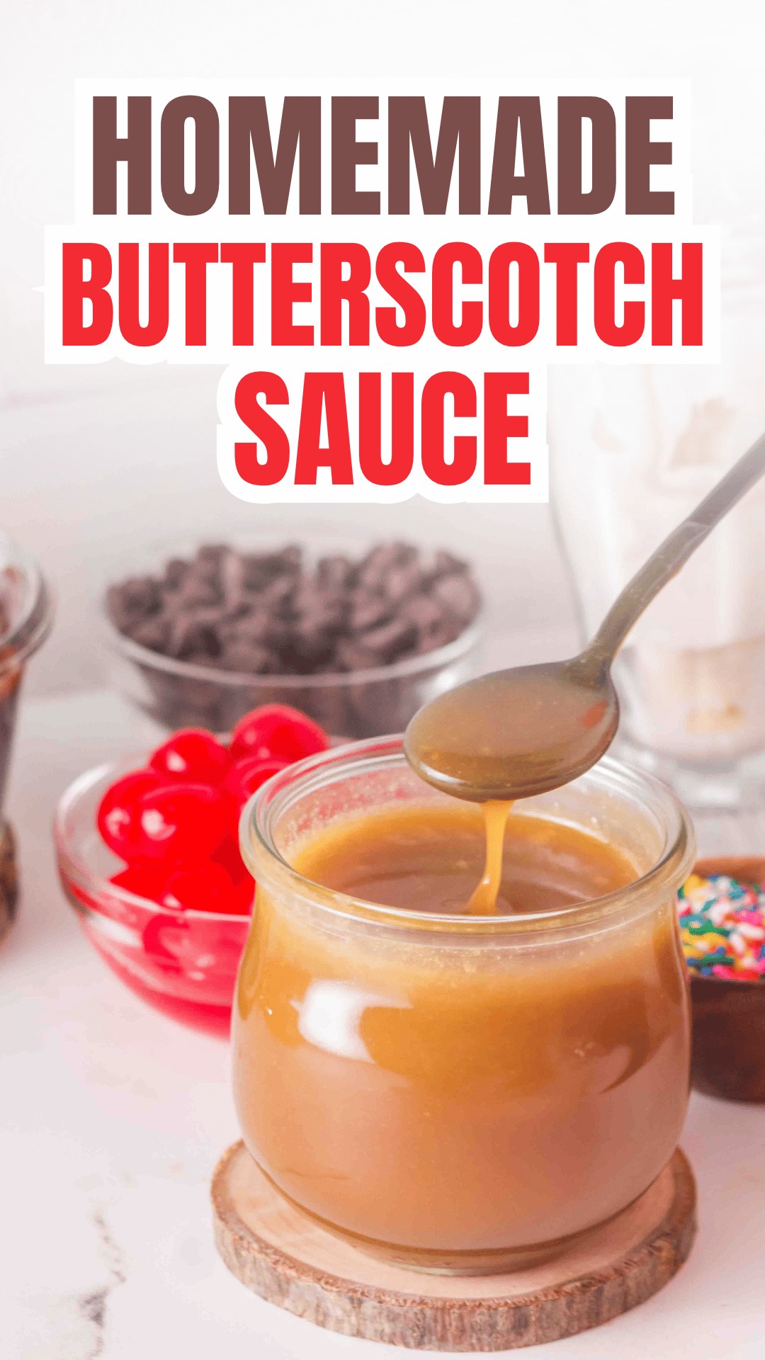 A spoon dipping into a jar of homemade butterscotch sauce, with red cherries, chocolate chips, and colorful sprinkles in the background. Text at the top reads Homemade Butterscotch Sauce. Perfect for anyone searching for the ultimate butterscotch sauce recipe, this scene captures the rich and creamy delight ready to be drizzled over your favorite desserts.